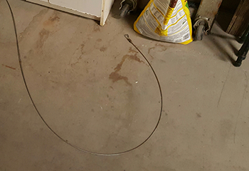 Tools and replacement cable prepared for garage door cable repair in Eden Prairie