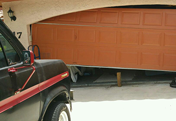 Emergency garage door repair in progress for off-track door at Chanhassen home
